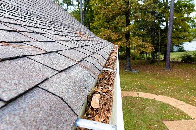 a gutter cleaning service in action